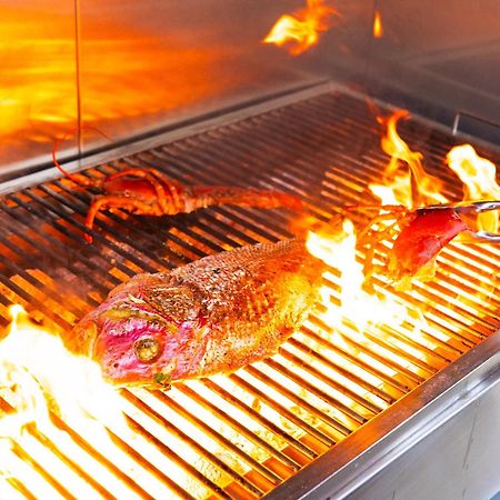 Voco Monaco Dubai By Ihg, Adults Only, World Islands Hotel Exterior photo A steak being grilled